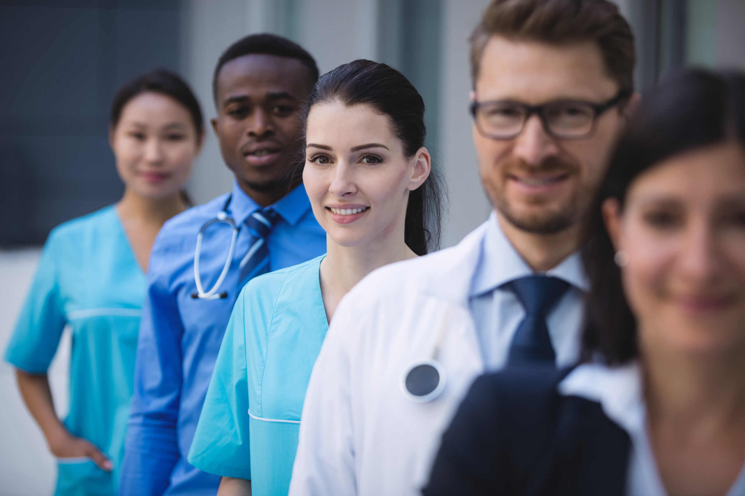 team doctors standing row scaled.jpg