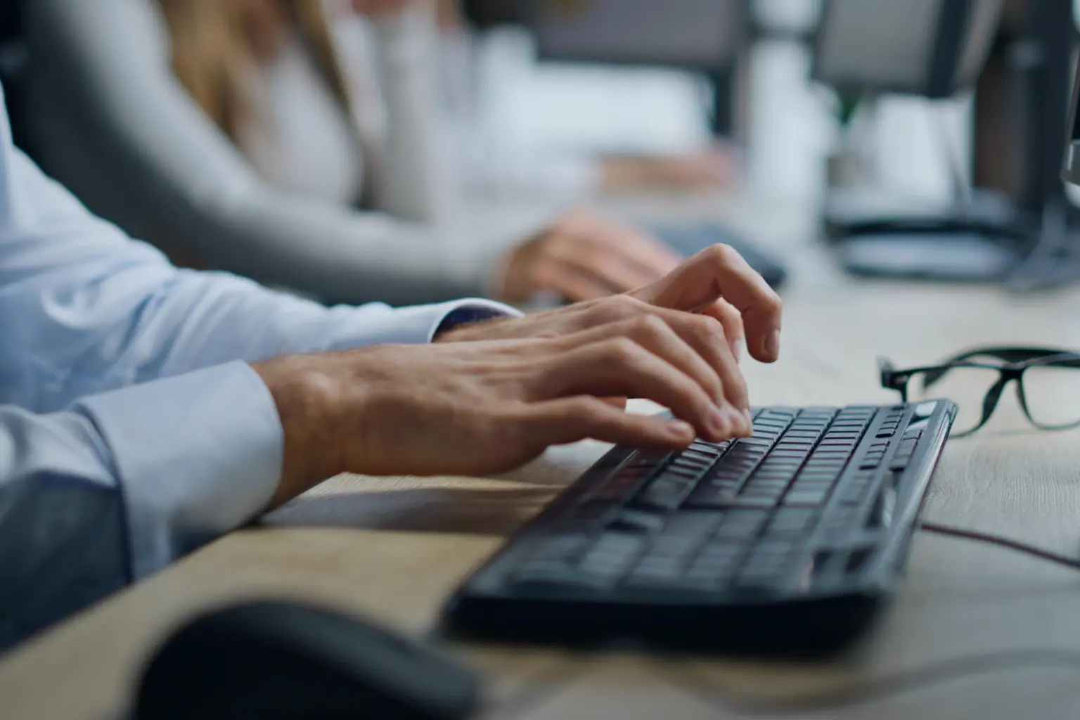 Technology support team working together in a real office